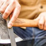 Man sharpening an axe